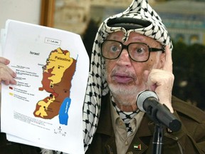 A file picture taken on November 9, 2003 shows Palestinian leader Yasser Arafat in the West Bank city of Ramallah. Arafat died in Percy military hospital near Paris aged 75 in November 2004 after developing stomach pains. His widow Suha has maintained he was poisoned, but the judges ruled there was "not sufficient evidence of an intervention by a third party who could have attempted to take his life," the prosecutor said. AFP Photo/Jamal Aruri/File