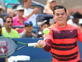 Milos Raonic of Canada returns a shot to Fernando Verdasco of Spain on day three of the 2015 U.S. Open tennis tournament at USTA Billie Jean King National Tennis Center. Anthony Gruppuso-USA TODAY Sports