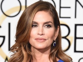 (FILES) This January 11, 2015 file photo shows model Cindy Crawford at the 72nd annual Golden Globe Awards, at the Beverly Hilton Hotel in Beverly Hills, California. Supermodel Cindy Crawford is producing a television series inspired by the wars between top modeling agencies in the 1980s, the US magazine Variety reported.The show "Icon" will chronicle the battles between the Ford Modeling Agency and Elite Model Management. Crawford, 49, won't star in the series, despite having become one of the most sought after models in her 1980s and 1990s heyday. (AFP PHOTO /MARK RALSTON)