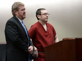 Colorado theatre shooter James Holmes appears in court, with his attorney Daniel King, to be formally sentenced, Wednesday, Aug. 26, 2015 in Centennial, Colo.  Holmes was sentenced to life in prison without parole by Judge Carlos Samour Jr.  Holmes killed 12 people and injured 70 others in the July 20, 2012 ambush.  (RJ Sangosti/The Denver Post via AP, Pool)