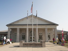 MOREHEAD, KY - SEPTEMBER 2: Same-sex marriage supporters (L) and those whose oppose the new law stand across from one another in front of the Rowan County Courthouse on September 2, 2015 in Morehead, Kentucky. Citing a sincere religious objection, Kim Davis, the Rowan County Clerk of Courts, who is an Apostolic Christian, has refused to issue marriage licenses to same-sex couples in defiance of a Supreme Court ruling.  (Ty Wright/AFP)