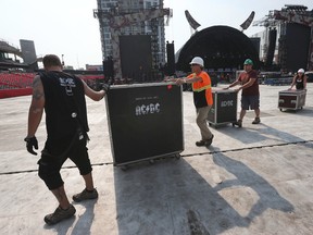 An AC/DC production crew sets up the stage at TD Place in Ottawa Wednesday Sept 2, 2015. The iconic band will be performing an outdoor concert at TD Place Thursday Sept. 3.  Tony Caldwell/Ottawa Sun/Postmedia Network