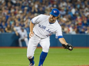 Blue Jays pitcher R.A. Dickey catches the ball during 4th inning action against the Indians in Toronto on Wednesday, Sept. 2, 2015. (Ernest Doroszuk/Toronto Sun)