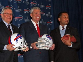 From left to right, Buffalo Bills president Russ Brandon, owner Terry Pegula, head coach Rex Ryan and GM Doug Whaley are all smiles during a press conference in Buffalo following the hiring of Rex Ryan as the team's new coach on Jan. 14, 2015. (John Kryk/Toronto Sun)