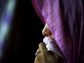 The mother of Meenakshi Kumari, 23, one of the two sisters allegedly threatened with rape by a village council in the northern Indian state of Uttar Pradesh, weeps inside her house at Sankrod village in Baghpat district, India, September 1, 2015. A village council in northern India has denied allegations that it ordered two young sisters to be raped because their brother eloped with a higher caste woman. The council's purported ruling led to an international outcry and hundreds of thousands of people have demanded their safety. Picture taken September 1, 2015. REUTERS/Adnan Abidi