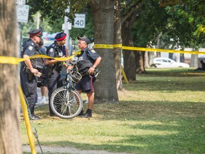 Police are seen at Moss Park after a woman was stabbed on Wednesday Sept. 2, 2015. (ERNEST DOROSZUK/Toronto Sun)