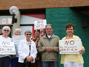 A group of people stage a protest outside Sudbury MPP Glenn Thibeault's office in Sudbury, Ont. on Wednesday, September 2, 2015. Protesters were also at Nickel Belt MPP France Gelinas' office. The protesters are opposed to the new sex-ed curriculum in Ontario. John Lappa/Sudbury Star/Postmedia Network