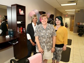 Catherine Courtemanche, middle, owner of Savannah's Family Hair Design and Spa in Chelmsford, Ont., with her stylists, Lise Provincial, left, and Hailey Chinn. John Lappa/Sudbury Star/Postmedia Network