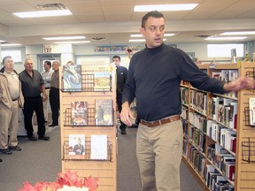 Brain Masschaele, right, director of community and cultural services for Elgin County, conducts a tour of the Rodney Library in this 2011 photo.