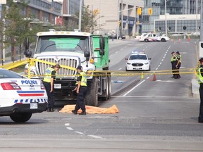 Police at the scene at Park Lawn and Lake Shore after a woman crossing the road was killed by a truck Thursday, Sept. 3, 2015. (Ernest Doroszuk/Toronto Sun)