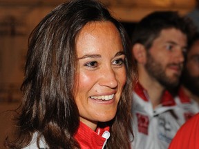 ANNAPOLIS, MD - JUNE 20: Pippa Middleton talks with teammates after finishing the Race Across America 2014 on June 20, 2014 in Annapolis, Maryland. (Larry French/Getty Images/AFP)