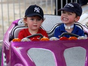 EMILY MOUNTNEY-LESSARD/THE INTELLIGENCER
Mason, left, and Damian, prepare to go on a ride during Terrific Thursday at the Quinte Exhibition. For the past four years, children with special needs have been able to access the fair ahead of the event opening to the public.