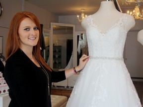 SARAH HYATT/THE INTELLIGENCER
Brook Miller, owner of Runway Bridal in downtown Belleville, at her store Thursday. Miller is part of the Downtown Bridal Walk on Sept. 12. Runway Bridal sells gowns, bridesmaids' gowns, tuxedos, flowers and accessories. The business is located at 390 Front St.