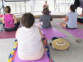 Lisa Craig leads a yoga class during the first Festival of Good Things held two years ago on the Point Lands near the Sarnia Bay Marina. This year's festival runs Friday evening and Saturday at the same location. (File photo)