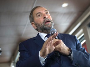 NDP Leader Thomas Mulcair makes a stop at a cafe as he continues his campaigning in Canada's Federal Election in Toronto on Thursday, September 3, 2015. THE CANADIAN PRESS/Chris Young