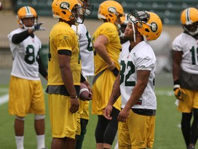 Former U Missouri teammates and current Eskimos James Franklin, left, and Kendial Larence chat during practice in August at Commonwealth Stadium. (Perry Mah, Edmonton Sun)