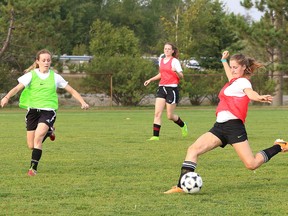 Members of Cambrian College women's soccer team participate in a drill during practice at Cambrian College in Sudbury, Ont. on Wednesday September 2, 2015.