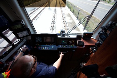 Motorman Allen Richard drives an LRT train during a media tour on the new Metro LRT line in Edmonton, Alta., on Thursday September 3, 2015. The LRT extension will open on Sunday, Sept. 6 cost a total of $665 million to build and connects Churchill Station to NAIT. Ian Kucerak/Edmonton Sun/Postmedia Network