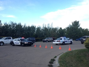Police investigate reports of a body being found near Kenndale Ravine behind 300 Hooper Crescent on Thursday evening. (CATHERINE GRIWKOWSKY/Edmonton Sun)