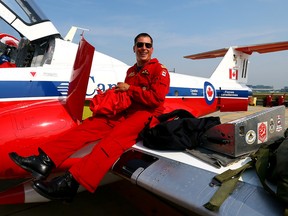 Snowbird 11 Coordinator Captain Regan Wickett unpacks the plane during media day for the Canadian International Air Show at Pearson airport in Toronto on Thursday, Sept. 3, 2015. (DAVE ABEL/Toronto Sun)