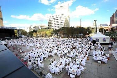1500 people prepare for food and wine during the Le Diner en Blanc dinner at Churchill Square in Edmonton, Alberta on September 3, 2015. Perry Mah/Edmonton Sun/Postmedia Network