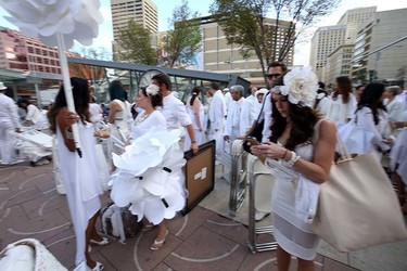 People wait to get into the Le Diner en Blanc dinner at Churchill Square in Edmonton, Alberta on September 3, 2015. Perry Mah/Edmonton Sun/Postmedia Network