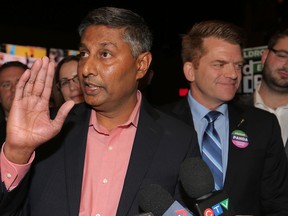 Prasad Panda (left) and Brian Jean from the Wildrose party celebrate with their team after winning the Calgary-Foothills bye-election at the Crowfoot Boston Pizza in NW Calgary, Alta. on Thursday September 3, 2015. Stuart Dryden/Calgary Sun/Postmedia Network