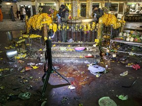 Blood and personal belongings of victims are seen as experts investigate at the Erawan shrine, the site of a deadly blast in central Bangkok August 17, 2015. (REUTERS/Athit Perawongmetha)