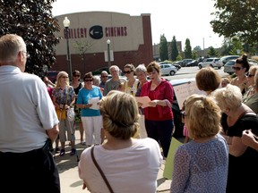 Cindy Churcher reads a speech to Oxford County MPP Ernie Hardeman at a rally protesting the provincial government's sex ed curiculum outside his office on Tuesday.