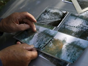 Retired miner and explorer Tadeusz Slowikowski shows pictures of an area where a Nazi train is believed to be located, in Walbrzych, southwestern Poland, on Sept. 4, 2015. (REUTERS/Kacper Pempel)