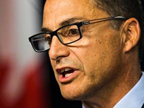 Alberta Finance Minister Joe Ceci gives a first quarter fiscal update and economic statement at the Alberta Legislature Building in Edmonton on Monday, Aug. 31.