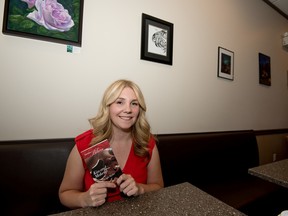 Taryn Leigh Taylor, who published her first novel Kiss and Makeup with Harlequin, poses for a portrait at Perks Coffee House in Spruce Grove on Monday, Aug. 31.