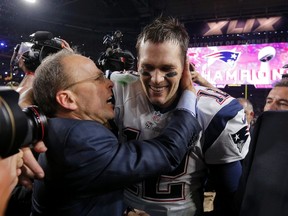 New England Patriots quarterback Tom Brady is congratulated by team president Jonathan Kraft after defeating the Seattle Seahawks in the Super Bowl in Glendale, Ariz., February 1, 2015.  (REUTERS/Brian Snyder)