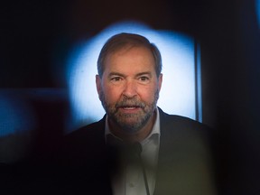 NDP leader Thomas Mulcair speaks to reporters during a federal election campaign stop at a seniors residence in Brossard, Que., on Sept. 4, 2015. (THE CANADIAN PRESS IMAGES/Graham Hughes)
