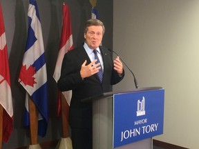 Mayor John Tory speaks to reporters at City Hall about the Syrian refugee crisis on Friday, Sept. 4, 2015. (Don Peat/Toronto Sun)