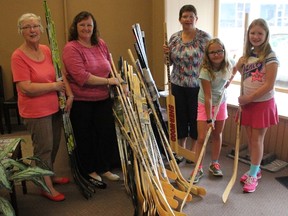 Marilyn Blake started collecting cash donations and Canadian Tire money to buy hockey sticks to donate. Her initial goal of 100 has been surpassed and she is aiming for 150. She donated 60 sticks to the Salvation Army is Clinton for its Christmas hamper program. Pictured here, from left to right, Pauline Thompson, Shannon Daniels, Marilyn Blake, Abigail Leduc and Clara Leduc. (Laura Broadley/Clinton News Record)