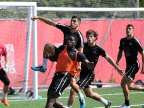 Ottawa Fury FC midfielder Mauro Eustaquio jumps over a crowd in front of the net during training at Algonquin College on Thursday, Sept. 3, 2015. (Chris Hofley/Ottawa Sun)