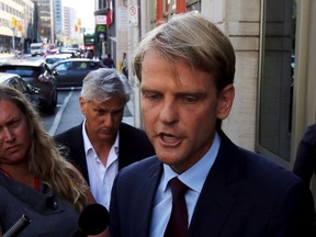 Immigration Minister Chris Alexander talks to reporters after a television interview in Ottawa on Thursday, September 3, 2015, in the wake of images of a Syrian child found drowned on the shores of Turkey. THE CANADIAN PRESS/Fred Chartrand