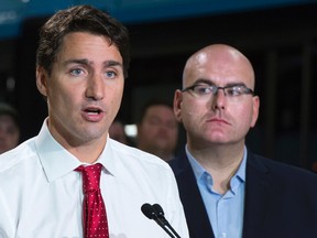 Liberal leader Justin Trudeau addresses employees and supporters during a campaign event in Richmond Hill, Ont., on Friday. News that the economy isn't struggling nearly as bad as expected is bad news for Trudeau and NDP leader Thomas Mulcair. (THE CANADIAN PRESS/Paul Chiasson)