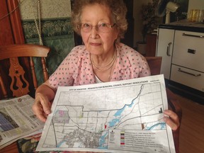 Betty Howes shows a map that includes her property  between Howes and Unity roads, north of Kingston , Ont. on Thursday September 3, 2015. SkyPower Projects negotiated to lease land from Howes to build their proposed solar project. City council didn't endorse the SkyPower project. Paul Schliesmann/The Kingston Whig-Standard/Postmedia Network