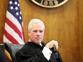 In this photo taken Oct. 26, 2012, Marion County Circuit Judge Vance Day presides over his courtroom in Salem, Ore.  Day, a former chairman of the Oregon Republican Party, is facing an ethics investigation after asking his clerks to refer couples seeking same-sex marriages to other county judges due to his religious beliefs. Day joined the bench in 2011 and has not performed any same-sex marriages. He stopped doing marriages of any kind this past spring. Marion County judges are not required to perform marriages. (Statesman-Journal via AP)