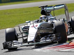 Mercedes driver Lewis Hamilton takes a corner on his way to getting the pole position for the Italian Grand Prix in Monza September 5, 2015.  (REUTERS/Max Rossi)