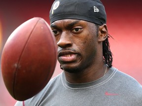 Robert Griffin III of the Washington Redskins looks on during warmups before playing against the Jacksonville Jaguars at FedExField on September 3, 2015 in Landover, Maryland.   (Patrick Smith/Getty Images/AFP)