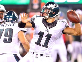 Philadelphia Eagles quarterback Tim Tebow drops back to pass against the New York Jets during   a preseason game at MetLife Stadium. (Brad Penner/USA TODAY Sports)