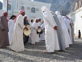 Kumzari men perform a traditional Dandana dance.