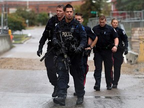 Police respond to a stand-off at the Gold Bar Wastewater Treatment Plant, in Edmonton Alta. on Friday Sept. 4, 2015. David Bloom/Edmonton Sun/Postmedia Network