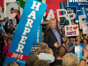 Supporters cheer as Conservative leader Stephen Harper delivers a speech during a campaign stop in Abbotsford,  Wednesday September 2, 2015.. THE CANADIAN PRESS/Adrian Wyld