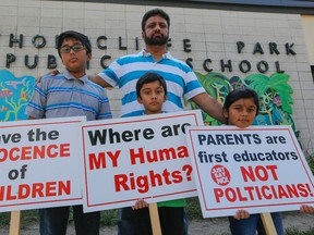 Khalid Mahmood will not be letting his three children -- Yahya, 11, Muhammad, 9,  and Tehreem, 6 -- back to  Thorncliffe Park Public School until he is assured they can opt-out of the new sex-ed curriculum. (DAVE THOMAS/Toronto Sun)