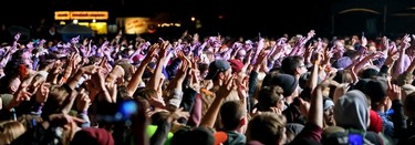 Fans raise their hands during Hozier' set at the 2015 SONiC BOOM Festival in Borden Park in Edmonton on Saturday Sept. 5, 2015. Tom Braid/Edmonton Sun/Postmedia Network.