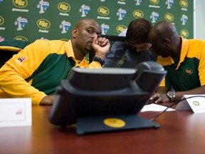 Edmonton Eskimos staff, including head scout Ed Hervey (left) and head coach Kavis Reed (right), prepare for the start of the 2012 CFL draft at Commonwealth Stadium in Edmonton, Alberta, on May 3, 2012. The team selected Austin Pasztor fourth overall in the draft. IAN KUCERAK/EDMONTON SUN